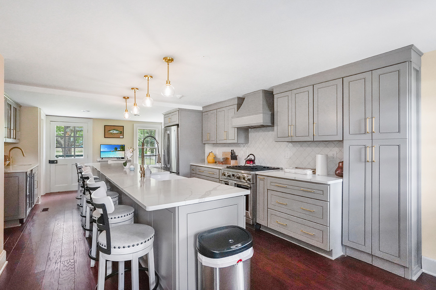 the completely remodeled kitchen in the manor house with seating for a large group