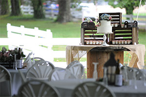 a place setting and wedding cake